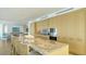 Spacious kitchen with granite countertop, stainless steel appliances, and custom cabinets at 280 Golden Gate Pt # 600, Sarasota, FL 34236