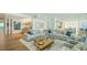 Open-concept living room with modern furnishings, wood floors, and stylish decor at 280 Golden Gate Pt # 600, Sarasota, FL 34236