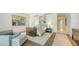 The main bedroom has a seating area and sleek wood flooring at 280 Golden Gate Pt # 600, Sarasota, FL 34236