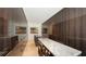 Spacious walk-in closet with built-in storage and marble-topped island at 280 Golden Gate Pt # 600, Sarasota, FL 34236