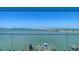 Breathtaking water view showcasing a bridge, docks, and clear blue skies from the balcony at 280 Golden Gate Pt # 600, Sarasota, FL 34236