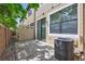 Backyard features a brick-paver patio, AC unit and mature shade trees at 288 Crew Ct, Sarasota, FL 34243