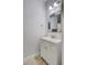Charming bathroom with white vanity, decorative mirror, and neutral color palette at 288 Crew Ct, Sarasota, FL 34243