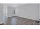 Bright, empty bedroom with a window, neutral paint, wood-look floors, and a double door closet at 288 Crew Ct, Sarasota, FL 34243