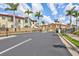 Gated community entrance featuring lush tropical landscaping and security access at 288 Crew Ct, Sarasota, FL 34243