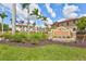 Welcoming entrance to Muirfield featuring lush landscaping and community signage at 288 Crew Ct, Sarasota, FL 34243