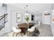 Bright dining area with modern decor, stylish furniture and bar seating with modern pendant lights at 288 Crew Ct, Sarasota, FL 34243