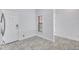 Entryway nook has a small window for natural light and durable tile flooring at 288 Crew Ct, Sarasota, FL 34243