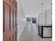 Bright and airy entryway featuring tile flooring, modern lighting, and open floorplan at 288 Crew Ct, Sarasota, FL 34243