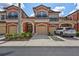 Charming townhome featuring a private garage, balcony, and well-manicured landscaping at 288 Crew Ct, Sarasota, FL 34243