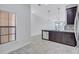 Bright eat-in kitchen features a large window, tile floors and an island with sink at 288 Crew Ct, Sarasota, FL 34243