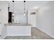 Open kitchen area featuring stylish countertops and contemporary lighting at 288 Crew Ct, Sarasota, FL 34243