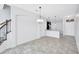 Open-concept living area with tiled floors and kitchen area in background at 288 Crew Ct, Sarasota, FL 34243