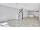 Open-concept living room with tile floors and staircase to the upper level at 288 Crew Ct, Sarasota, FL 34243