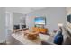 Living room featuring hardwood floors, stylish furniture and large windows at 288 Crew Ct, Sarasota, FL 34243
