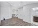 Open loft space with hardwood floors and a view of the staircase at 288 Crew Ct, Sarasota, FL 34243