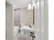 Bathroom with tile surround, white vanity, and chrome fixtures at 2947 Goodrich Ave, Sarasota, FL 34234