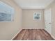 Bedroom with wood floors and natural light at 2947 Goodrich Ave, Sarasota, FL 34234