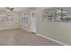Bright living room with tile floors, neutral paint, and natural light from multiple windows at 2947 Goodrich Ave, Sarasota, FL 34234