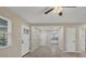 Open living room featuring tile floors, neutral paint, and natural light at 2947 Goodrich Ave, Sarasota, FL 34234