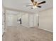 Open-concept living space with tile floors leading to the kitchen and other rooms at 2947 Goodrich Ave, Sarasota, FL 34234