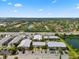 Aerial shot showcasing the community's proximity to a lake, pool, ample parking, and neighborhood amenities at 2950 Clark Rd # 113, Sarasota, FL 34231