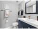 Charming bathroom featuring updated vanity, brushed nickel hardware and beach decor at 2950 Clark Rd # 113, Sarasota, FL 34231