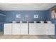 Community laundry room featuring rows of washers and dryers for convenient laundry care at 2950 Clark Rd # 113, Sarasota, FL 34231
