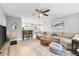 Open-concept living area with comfortable seating, stylish decor, and seamless flow to the dining area at 2950 Clark Rd # 113, Sarasota, FL 34231