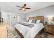 Spacious bedroom with ceiling fan, ensuite bath and walk-in closet at 2950 Clark Rd # 113, Sarasota, FL 34231