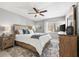 Comfortable bedroom with a ceiling fan, and soft natural light at 2950 Clark Rd # 113, Sarasota, FL 34231