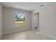 Bedroom featuring neutral tile flooring and view to neighborhood at 3505 27Th W Ave, Bradenton, FL 34205