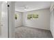 Bright bedroom with a ceiling fan and two large windows at 3505 27Th W Ave, Bradenton, FL 34205