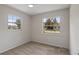 Comfortable bedroom with two large windows for natural light and neutral carpeting at 3505 27Th W Ave, Bradenton, FL 34205