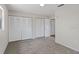Bedroom featuring three large closets and neutral carpeting at 3505 27Th W Ave, Bradenton, FL 34205