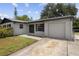 Charming home with a well-maintained lawn and a driveway leading to a single-car garage at 3505 27Th W Ave, Bradenton, FL 34205