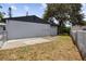 Exterior view of the home, showing the back of the house and chain link fence at 3505 27Th W Ave, Bradenton, FL 34205