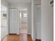 Hallway with wood flooring and view to bathroom at 3505 27Th W Ave, Bradenton, FL 34205
