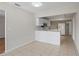 Well-lit kitchen with ample counter space, a breakfast bar and tile flooring at 3505 27Th W Ave, Bradenton, FL 34205