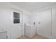 Bright laundry room with tile floors, a washing machine, and a door to the outside at 3505 27Th W Ave, Bradenton, FL 34205