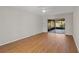 Bright living room with wood floors, a ceiling fan, and sliding glass doors at 3505 27Th W Ave, Bradenton, FL 34205