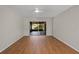 Open living area with hardwood flooring and sliding glass doors to the backyard at 3505 27Th W Ave, Bradenton, FL 34205