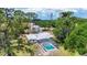 Expansive property with screened-in pool and lush landscape, offering a private and luxurious retreat at 4311 52Nd E St, Bradenton, FL 34208