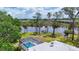 Beautiful aerial perspective revealing the pool, dock, and serene waterfront setting of this remarkable property at 4311 52Nd E St, Bradenton, FL 34208