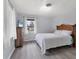 Comfortable bedroom with hardwood floors, light-filled windows, and a serene atmosphere for rest and relaxation at 4311 52Nd E St, Bradenton, FL 34208