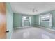 Light-filled bedroom with green walls, neutral flooring, and large windows at 4311 52Nd E St, Bradenton, FL 34208