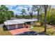 Aerial view of a single-story home with an attached two-car garage and mature landscaping at 4311 52Nd E St, Bradenton, FL 34208