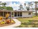 Inviting single-story home with a well-maintained lawn and walkway to a screened entrance at 4311 52Nd E St, Bradenton, FL 34208