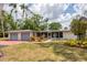 Charming single-story home with an attached garage, lush lawn, and attractive landscaping at 4311 52Nd E St, Bradenton, FL 34208