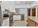 Updated kitchen featuring granite countertops, white cabinets and stainless steel appliances at 4311 52Nd E St, Bradenton, FL 34208